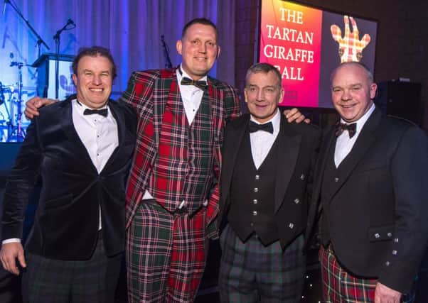 Doddie Weir with Tartan Giraffe Ball organisers Stewart Bennet, David Baird and Douglas Stephen.