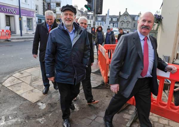 Ian Davidson leads Mr Corbyn, Richard Leonard and Scott Redpath to the party campaign headquarters.