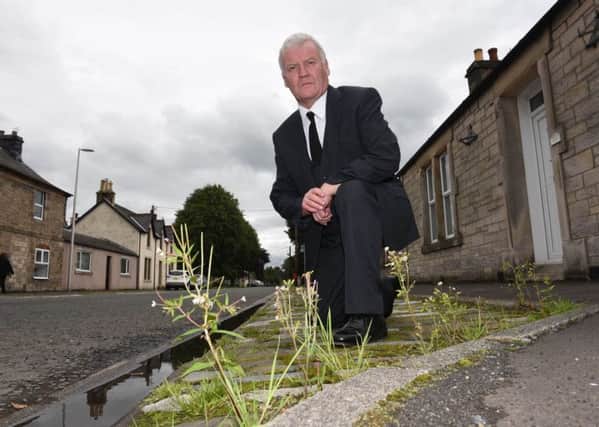 Hawick and Hermitage councillor Davie Paterson in Newcastleton's North Hermitage Street.