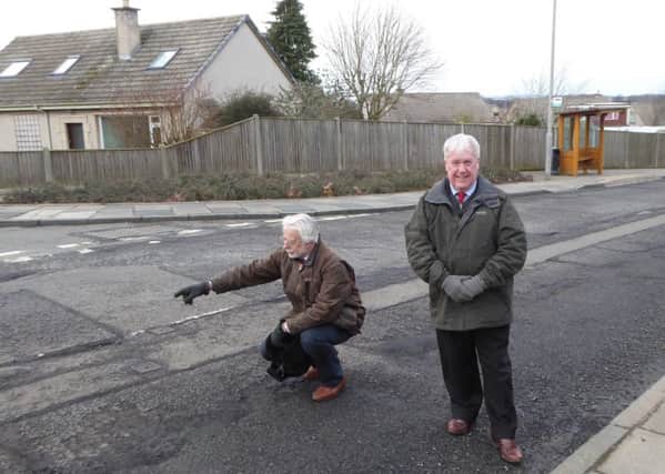 Kelso councillors Simon Mountford and Tom Weatherston in the town's Jedburgh Road.