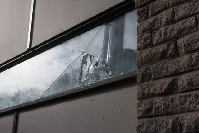 Broken window at Laidlaw Memorial Pool.