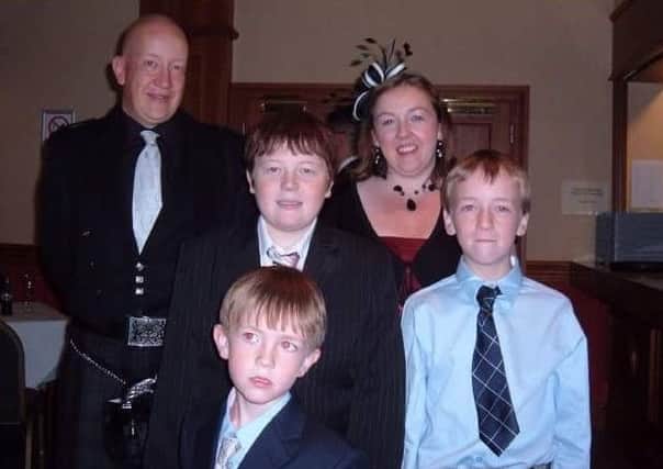 The late Anthony Mundell, centre, with his family.