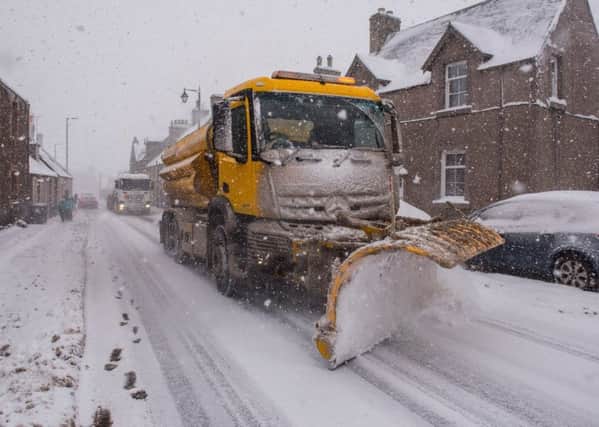 A snowplough fighting to keep the A68 road open in Lauder.