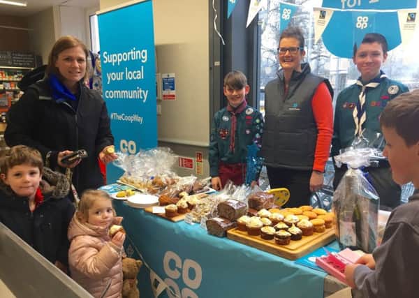 customers at Melrose Co-op were faced with a table-top sale consisting of cakes and sweets made from Fairtrade ingredients, thanks to the efforts of friends and supporters of local Scouts Matthew Cove and Dougray Seggie, pictured