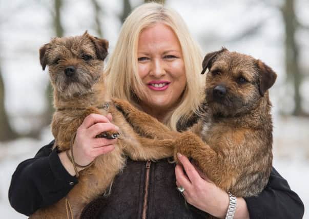 Kath Lothian with her Border terriers Jimi and Duke.