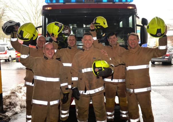 Hawick fire station's Stewart Beattie, fourth from left, has just retired after 27 years as a firefighter.