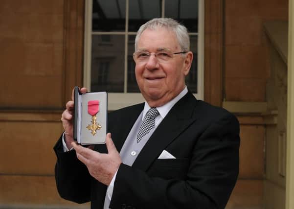 Graham Garvie with his OBE at Buckingham Palace.