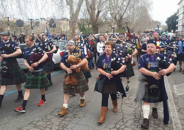 Galashiels pipers Elizabeth and Billy Easson help lead the Doddie Gump march through Rome on Saturday.