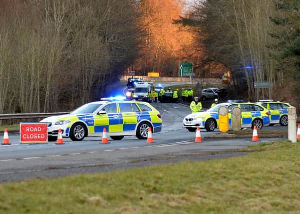 Police and ambulance staff on the A68 near Leaderfoot following a fatal collision there last night.