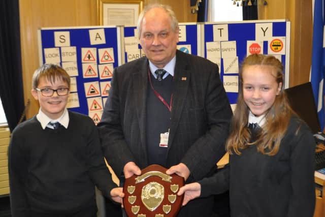 Scottish Borders Council Active School Award winners James Fobister and Zoe Imray of Hawick High with Selkirkshire councillor Gordon Edgar.