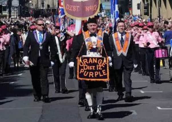 There are still plans to hold an Orange Walk through the streets of Hawick next month, despite the application to run a bar in the town's Auld Baths was withdrawn.