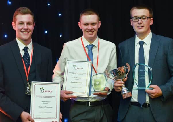 Kieran Paxton, centre, and Robert Pickford, left, from Jedburgh, and Kelsos Reece McNaughton, right, picked up Lantra Scotlands annual Land-based and Aquaculture Learner of the Year Awards in Dunblane last Wednesday night.