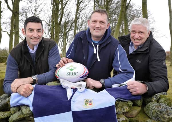 Scotland rugby legend Doddie Weir, centre, on his Borders farm with former college classmates Hamish Dykes, left, and David Ireland.