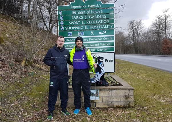 Rory Bannerman and son Charlie at the start of a sponsored walk from Hawick to Newcastle.