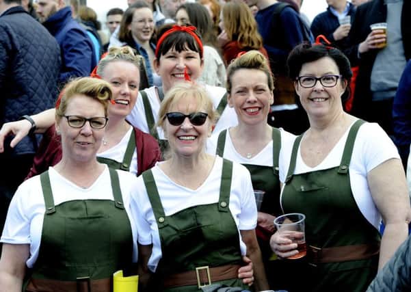 Ladies dressed as land girls stand out from the crowd at the Greenyards.