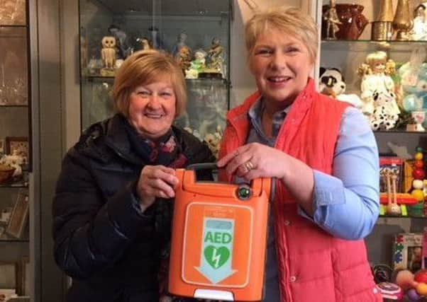 Liz Spowart from Jedburgh Rotary Club's charity shop, which helped fund the defib, with Christine Wylie, right.