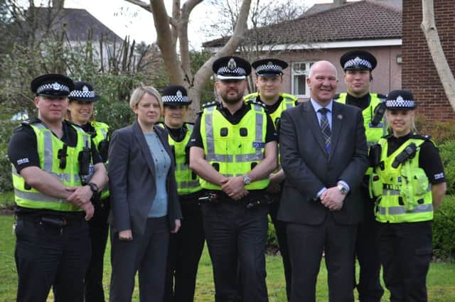 Scottish Borders Council leader Shona Haslam and councillor Watson McAteer, chair of the Police, Fire and Safer Communities Board, alongside Local Area Commander Andy McLean (centre) and the new community policing team.