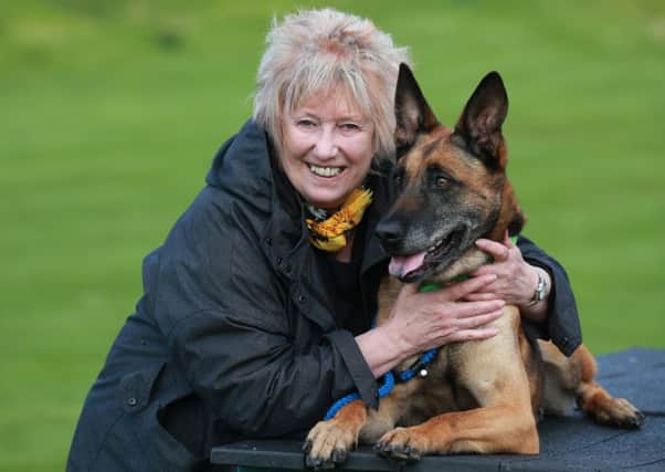 MSP Christine Grahame with an eight-year-old Dutch shepherd at Edinburgh Cat and Dog Home.