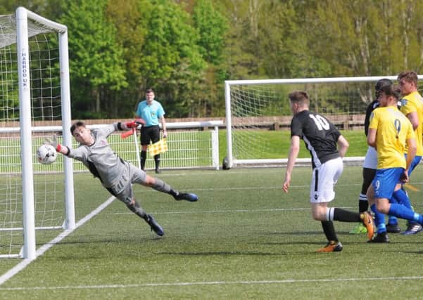 David Banjo (partially hidden) puts Selkirk 1-0 against Cumbernauld Colts in the Lowland League Cup Final at Netherdale.