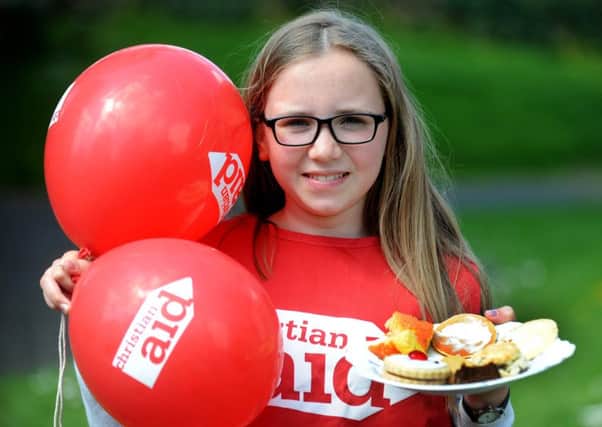 18/5/18 Melrose. Eleven year old Thea Foulkes from Gattonside, a pupil from Melrose Primary School, attending a Christian Aid Week fundraiser at Melrose Parish Church on Saturday (19th May). There was tea, coffee, fresh baking and a raffle. The event was organised by the Melrose and District Christian Aid Committee under the leadership of Nancy McNicol. Dave Peters from Gattonside, a committee member who helped organise the event, said: "We are very grateful to all our volunteers and those who came and enjoyed the coffee morning here today".