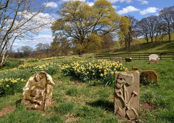 the old burial ground at Crailing where there are some good 17th and 18th century symbolic gravestones.
