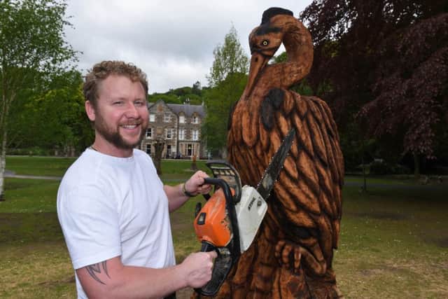 Sculptor Mark Hume with his Heron sculpture in Wilton Lodge Park, Hawick.