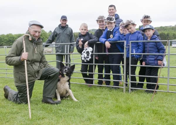Scott Purvis with pupils from Eyemouth Primary school were given a demonstration on using dogs to pen sheep by Scott Smith from Seahouses