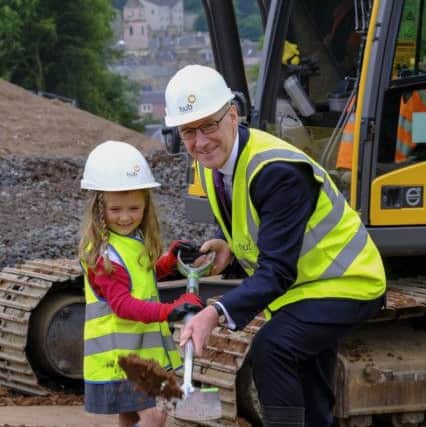 Ella McGovern of Parkside Primary with deputy first minister John Swinney.