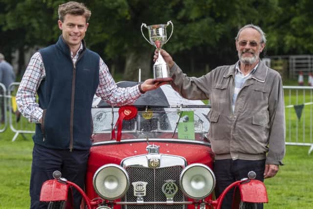 Best in show winner Graham Runcieman from Glasgow (right) with his 1932 MG J2, pictured receiving the Brewin Cup from Johnny Fleming from Brewin Dolphin.