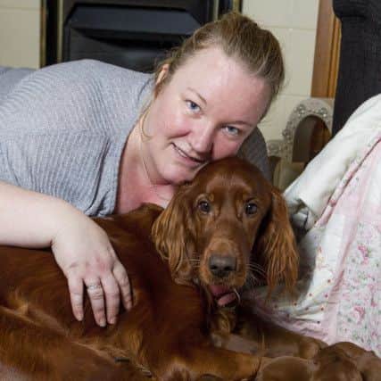 Owner Lisa Wardle and Poppy with her pups last year. Photo: Katielee Arrowsmith/SWNS.