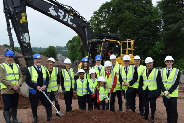 John Swinney with the dig party, which includes local school pupils, council leader Shona Haslam and local councillors.