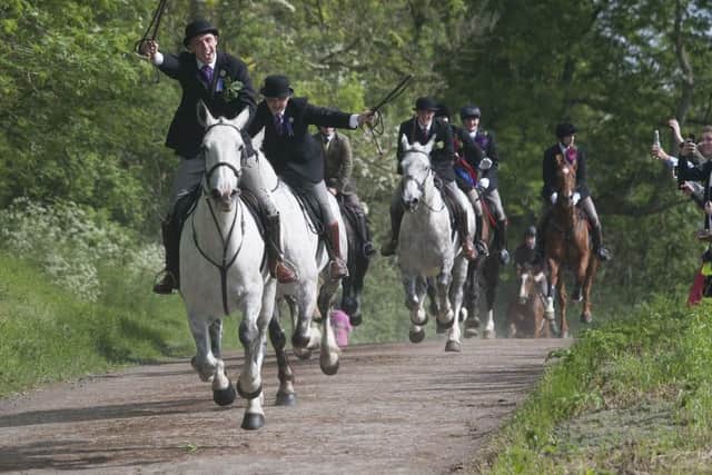 Langholm Cornet Iain Little charging up the chase.