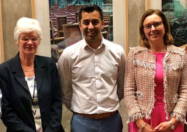Scottish Government transport minister Humza Yousaf with A7 action group members Marjorie McCreadie, left, and MSP Rachael Hamilton.