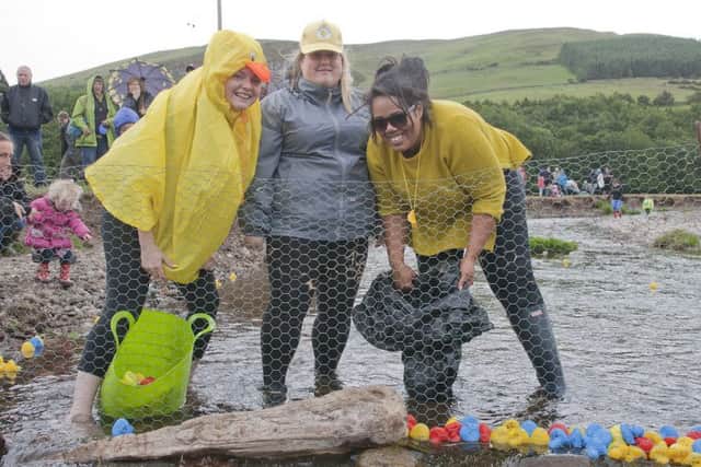 Bari Manushi Natasha Gray gets the duck race going with help from her predecessors Amberlie Allen and Cassie Quashie.