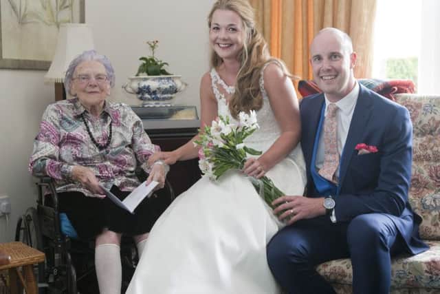 Janet Smith, 99, with her granddaughter Kirsty Medcalf and her new husband David Medcalf at Queens House care home, Kelso.