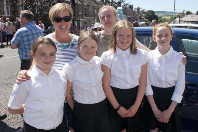 Mums Lynne Cowe and Clair Norris with Morebattle primary school girls, Tilly Bourne, Finlay Hogarth, Jessie Norris and Zoe Cowe who danced a reel with the principals.