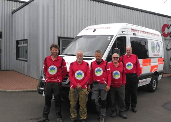 Members of the Borders Search and Rescue unit with their new bespoke ambulance.