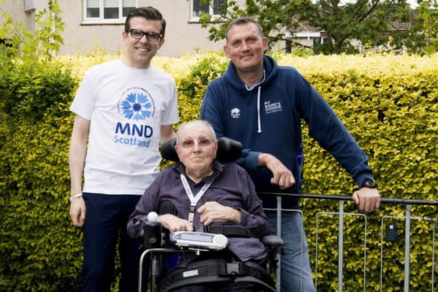 Doddie Weir, right, with MND Scotland chairman Lawrence Cowan, left, and grant beneficiary Jim Grant.