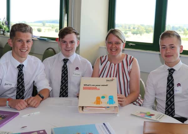 Scottish Borders Council leader Shona Haslam with pupils from Kelso High at the launch of the See Me programme at the town's racecourse on Monday.