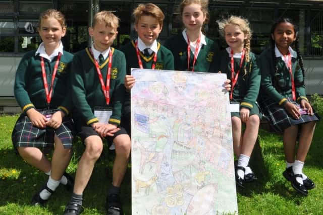 Pupils from St Mary's School in Melrose with their welcome sign.