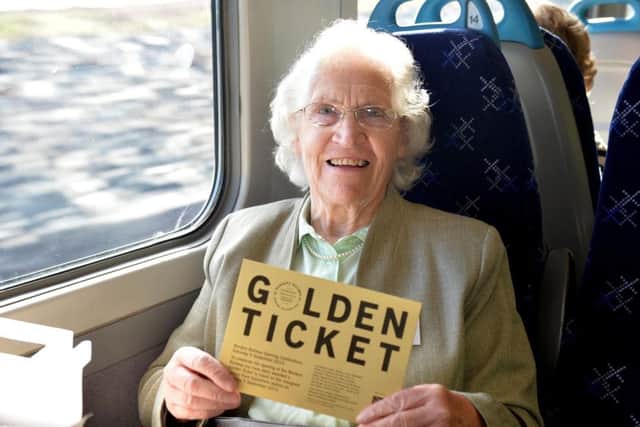 Hawick rail campaigner Madge Elliot with her golden ticket aboard one of the first services on the Borders Railway in 2015.