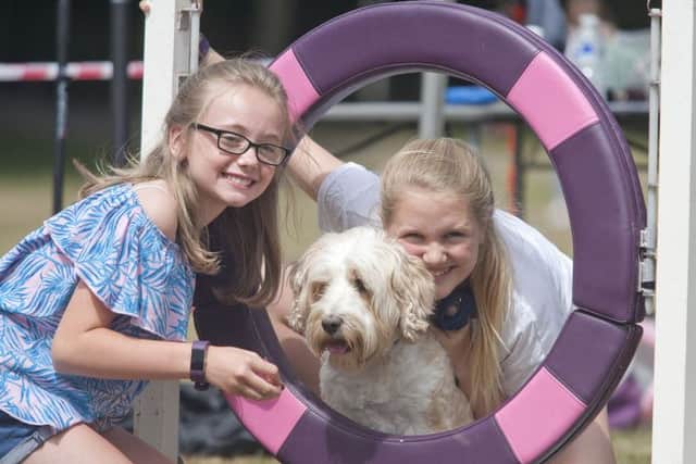 Lillian Hogan and Iona Taylor with Hollie at the agility course.