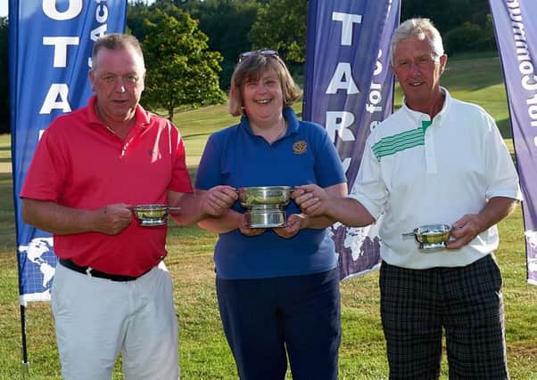 Galashiels Rotarians held their annual sponsored golf competition for the New Millennium Quaich Trophy at Torwoodlee Golf Club when 18 teams of four took part. Club president Ruth Collin, pictured, presented the prizes.
Results  1, Pheasant Pluckers (Jimmy Graham, pictured left; Scott Nightingale; Jimmy Kelly, pictured; Andrew James)