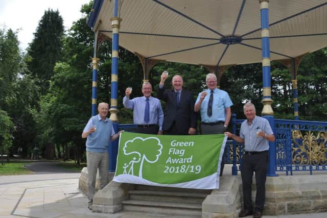 From left, Jake Coltman of Hawick in Bloom, councillors George Turnbull, Watson McAteer and Stuart Marshall and Alex Bell of Hawick in Bloom toast Wilton Lodge Park picking up Green Flag status.