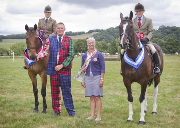 Gilliam McCowan, Berwick Supreme Champion, with judges Doddie and Kath Weir, and reserve champion Clive Storey from Yetholm.