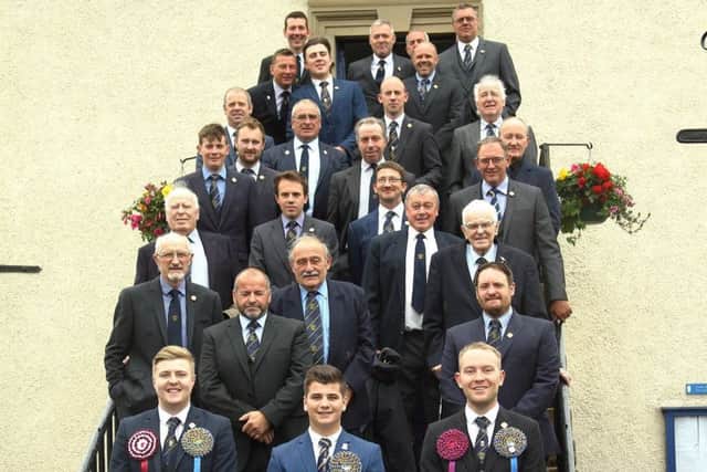 Chris Rogerson is flanked by the town's previous cornets ahead of Sunday's kirking ceremony. PHOTO: KENNY WHITE.