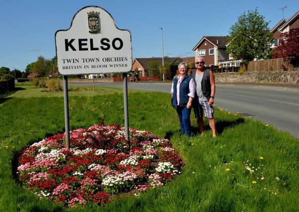 Kelso in Bloom was among numerous such groups opposed to the council's decision to cut grass less often and stop providing bedding plants. Pictured here are members Betty Hodger and Lewis Hamon.