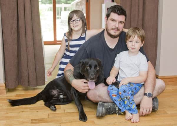 Family  pet 'Turbo' with owner Stuart Drynan and kids Kaitlynn and Blake