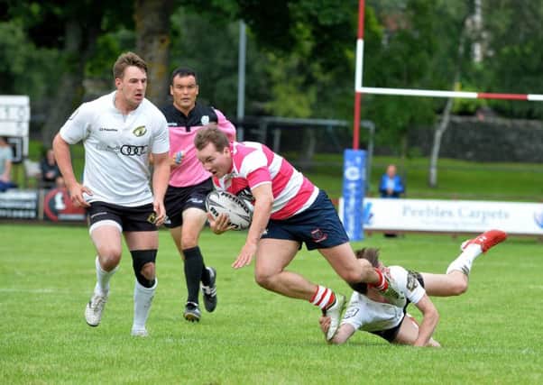 Hosts Peebles in action at The Gytes against eventual winners Melrose in the 2016 Sevens (picture by Alwyn Johnston)