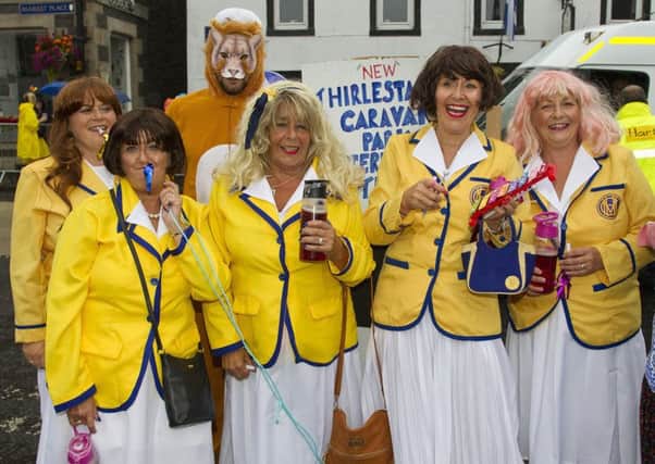 The Yellow Coats from Thirlistane Caravan Park enjoy the parade.